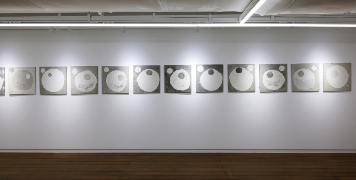 Gallery view- Untitled-stcmt-2550-1-11, 2025, graphite, stainless net, pigment, glue, oil, acrylic on cement panel, 600 x 50 cm (whole), 50 x 50 cm (each)